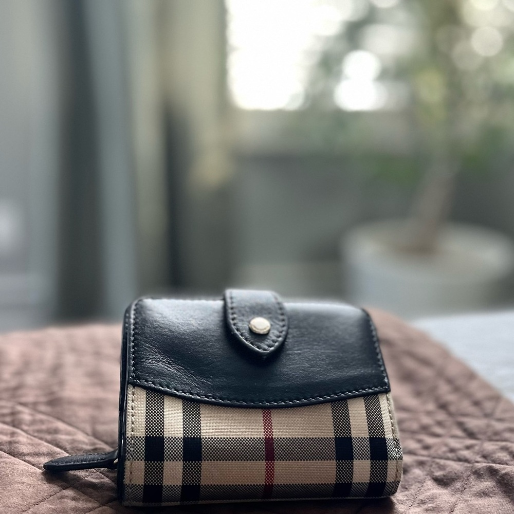 Burberry wallet good condition with exception of worn embroidery.